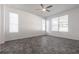 Bright bedroom featuring tile flooring, three blind-covered windows, and neutral colored walls at 5017 46Th W St, Bradenton, FL 34210