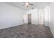 Bright bedroom features a tiled floor, ceiling fan, walk-in closet, and ensuite bathroom at 5017 46Th W St, Bradenton, FL 34210
