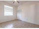 Bedroom features a large window, tiled floor and closet at 5017 46Th W St, Bradenton, FL 34210