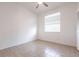 Comfortable bedroom with ceiling fan, tile flooring, a window with blinds, and ample natural light at 5017 46Th W St, Bradenton, FL 34210