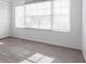 Bright bedroom with gray tiled flooring, large window, and closet at 5017 46Th W St, Bradenton, FL 34210