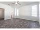 Spacious bedroom featuring tile flooring, ceiling fan, and natural light from multiple windows at 5017 46Th W St, Bradenton, FL 34210