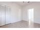 Spacious bedroom with tile flooring, bi-fold closet doors and entry to the rest of the home at 5017 46Th W St, Bradenton, FL 34210