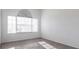 Sunlit bedroom with gray tile floor and large window with blinds at 5017 46Th W St, Bradenton, FL 34210