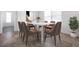 Elegant dining room with a marble table, seating for six, and a modern plant at 5017 46Th W St, Bradenton, FL 34210