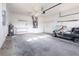 A spacious garage with a golf cart, storage, and a water heater at 5017 46Th W St, Bradenton, FL 34210