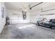 Spacious garage featuring a golf cart, ample storage space, and an organized layout, perfect for hobbyists at 5017 46Th W St, Bradenton, FL 34210