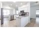 Bright kitchen features white cabinets and stainless steel appliances at 5017 46Th W St, Bradenton, FL 34210