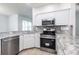 Bright kitchen features stainless steel appliances and updated countertops at 5017 46Th W St, Bradenton, FL 34210