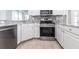 Well-equipped kitchen featuring stainless steel appliances, stone counters, and tile floor at 5017 46Th W St, Bradenton, FL 34210