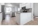 Contemporary kitchen with stainless steel appliances, white cabinetry, and tile floors at 5017 46Th W St, Bradenton, FL 34210