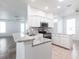 Bright kitchen features white cabinets and stainless steel appliances at 5017 46Th W St, Bradenton, FL 34210