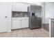 Bright kitchen featuring stainless steel appliances, white cabinets, and tile flooring at 5017 46Th W St, Bradenton, FL 34210