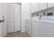Laundry room features white washer, dryer and bi-fold closet at 5017 46Th W St, Bradenton, FL 34210