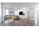 Stylishly decorated living room with comfortable seating, a modern area rug, and a large flat-screen television at 5017 46Th W St, Bradenton, FL 34210