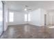 Bright living room with neutral tile floors, a ceiling fan and sliding doors to the outside at 5017 46Th W St, Bradenton, FL 34210