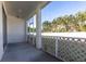 Enclosed patio includes white walls, white lattice and a view of palm trees at 5017 46Th W St, Bradenton, FL 34210