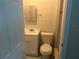 Standard bathroom with a toilet and a sink featuring a cabinet at 5106 Gateway Dr, Tampa, FL 33615
