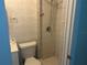 Tiled bathroom featuring a toilet and a shower at 5106 Gateway Dr, Tampa, FL 33615