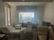 Bright bedroom with a large window, a daybed, and eclectic decor at 5106 Gateway Dr, Tampa, FL 33615