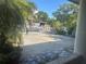 Wide driveway with a white metal gate and lots of space for parking at 5106 Gateway Dr, Tampa, FL 33615