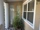 Cozy entrance featuring elegant tile flooring, a decorative pillar, and a large bright window at 5106 Gateway Dr, Tampa, FL 33615