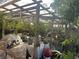 Enclosed patio featuring translucent roof, hanging planters and brick pavers at 5106 Gateway Dr, Tampa, FL 33615