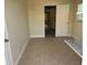 Empty room featuring tiled floors and an open door at 5106 Gateway Dr, Tampa, FL 33615