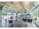 Open-air bar and grill area with ample seating, a full bar, and views of the community pool at 5119 Summit View Dr, Brooksville, FL 34601