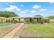 Backyard with a lush lawn and a swimming pool at 5821 52Nd N Ave, Kenneth City, FL 33709