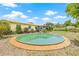 Lush backyard featuring a unique above-ground pool, perfect for relaxation and entertainment at 5821 52Nd N Ave, Kenneth City, FL 33709