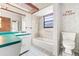 Bathroom features a bath tub, vanity with storage, and tile surround at 5821 52Nd N Ave, Kenneth City, FL 33709