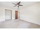 Neutral bedroom with ceiling fan, closet space, and plenty of room for personalization at 5821 52Nd N Ave, Kenneth City, FL 33709