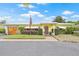 Charming single-story home featuring a well-manicured front yard and inviting entrance at 5821 52Nd N Ave, Kenneth City, FL 33709