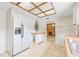 Kitchen with white refrigerator, classic countertops, and ample natural light at 5821 52Nd N Ave, Kenneth City, FL 33709