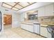 Classic kitchen with sleek countertops, stainless steel appliances, and plenty of cabinet space for storage at 5821 52Nd N Ave, Kenneth City, FL 33709