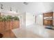 Open living space with terrazzo floors, wood accents, and ample natural light at 5821 52Nd N Ave, Kenneth City, FL 33709