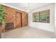 Cozy area with wood paneling, a light fixture, and views of the greenery outside at 5821 52Nd N Ave, Kenneth City, FL 33709