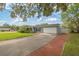 A lovely one-story house featuring an attached garage and a brick-laid driveway at 602 Hillpoint Way, Brandon, FL 33510