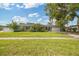 Well-maintained one-story home featuring a lush green lawn and mature trees at 602 Hillpoint Way, Brandon, FL 33510