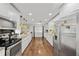 Modern kitchen featuring stainless steel appliances and all-white cabinetry at 602 Hillpoint Way, Brandon, FL 33510