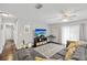 Cozy living room features modern decor, wood flooring, and access to outdoor light at 602 Hillpoint Way, Brandon, FL 33510
