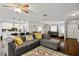 Spacious living room features wood floors, modern furnishings, and open access to kitchen at 602 Hillpoint Way, Brandon, FL 33510
