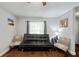 Cozy room with black futon and gray walls at 602 Hillpoint Way, Brandon, FL 33510