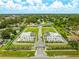 Aerial view of new development homes in a neighborhood with a community pool, showcasing the landscape and layout at 6206 64Th N Way, Pinellas Park, FL 33781