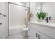 Bright bathroom with a shower-tub combo and a white vanity at 6206 64Th N Way, Pinellas Park, FL 33781