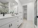 Bright bathroom with a walk-in shower and double sink vanity at 6206 64Th N Way, Pinellas Park, FL 33781