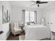 Bright bedroom features a ceiling fan, neutral decor, and natural light from the window at 6206 64Th N Way, Pinellas Park, FL 33781