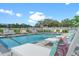 Community pool area featuring comfortable lounge chairs, a clean pool, and relaxing outdoor space at 6206 64Th N Way, Pinellas Park, FL 33781