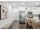 Bright kitchen features stainless steel appliances, white cabinets, and quartz countertops with seating at 6206 64Th N Way, Pinellas Park, FL 33781